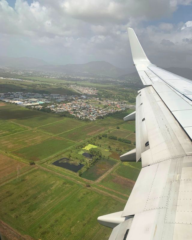 Picture of airplane landing and hills